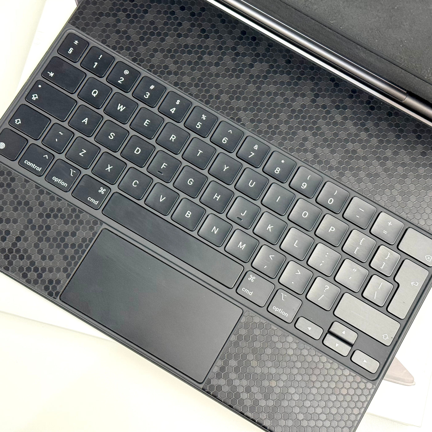 Close-up of the International English keyboard and trackpad on a pre-owned Apple Magic Keyboard 12.9-inch