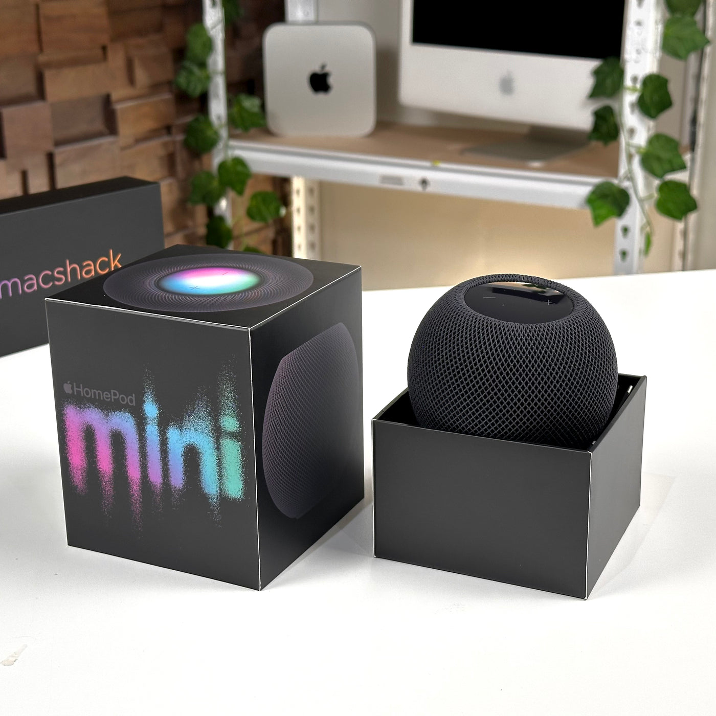 Pre-owned Apple HomePod mini Space Gray beside its open box - MacShack