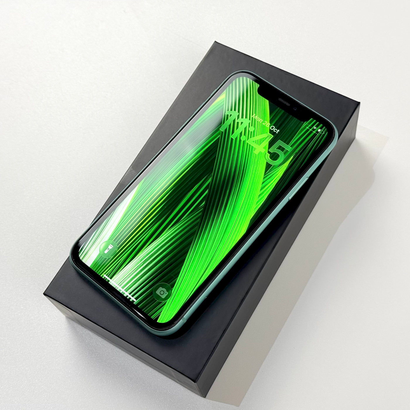 Pre-owned iPhone 11 64GB Green in box with screen on, Select condition - Mac Shack