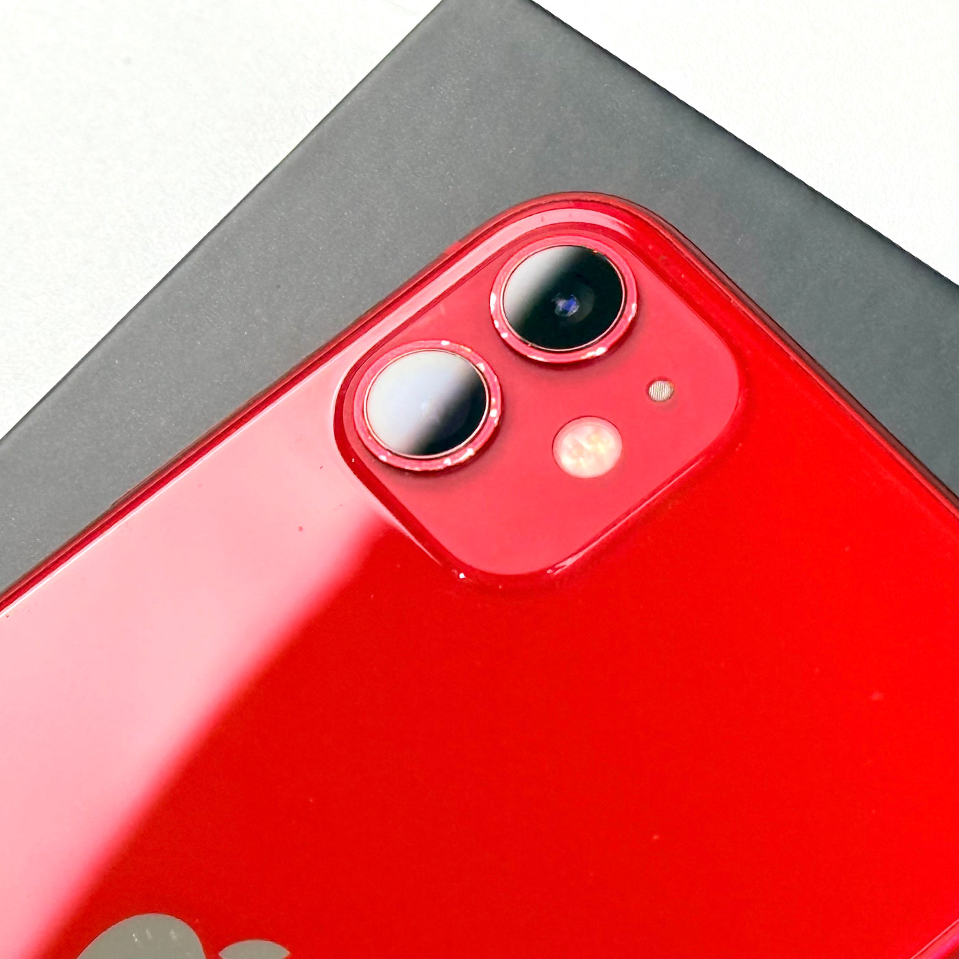 Close-up of pre-owned iPhone 11 Red dual 12MP rear camera - Mac Shack
