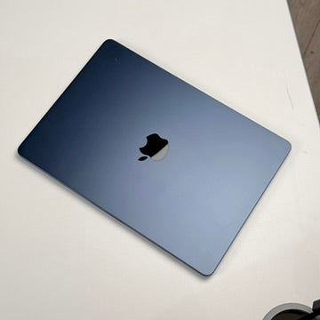 Lid and Apple logo of a pre-owned MacBook Air 13-inch M3 in Midnight - Mac Shack