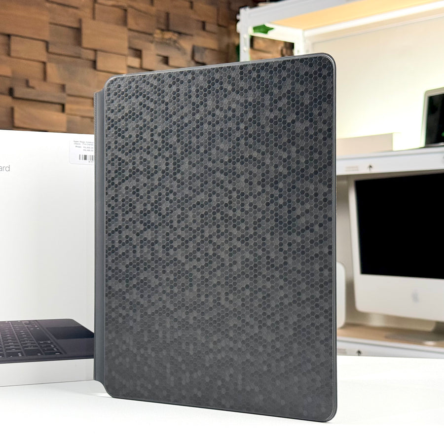 Pre-owned Apple Magic Keyboard for iPad Pro 12.9-inch standing upright, showing the fitted grey skin