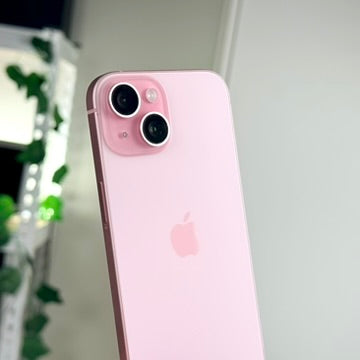 Pink iPhone 15 rear dual camera close-up
