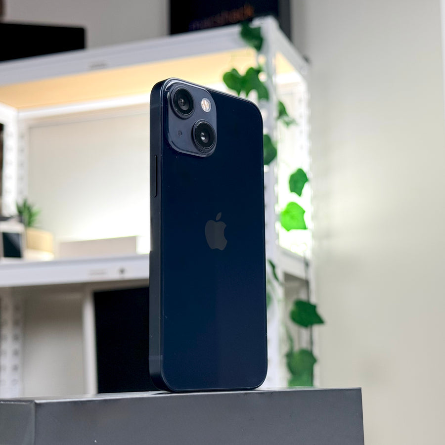 Pre-owned iPhone 13 mini 128GB Midnight standing upright, rear view - Mac Shack