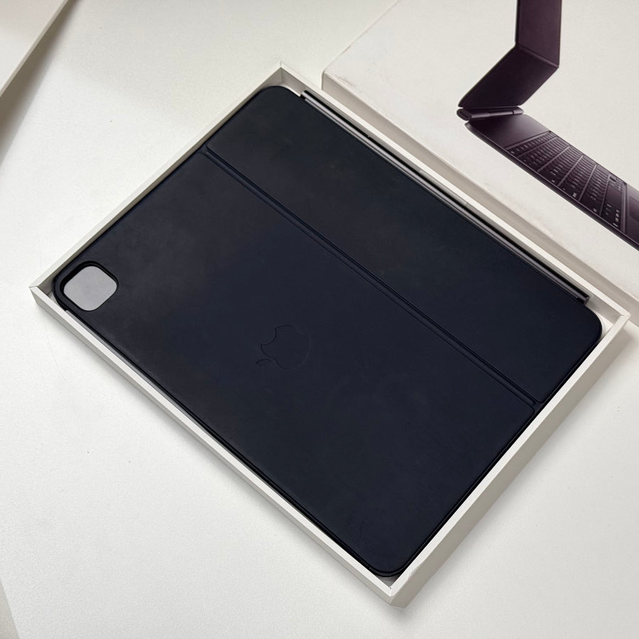 Pre-owned black Apple Magic Keyboard for iPad Pro 13-inch closed, showing the outer cover – actual unit