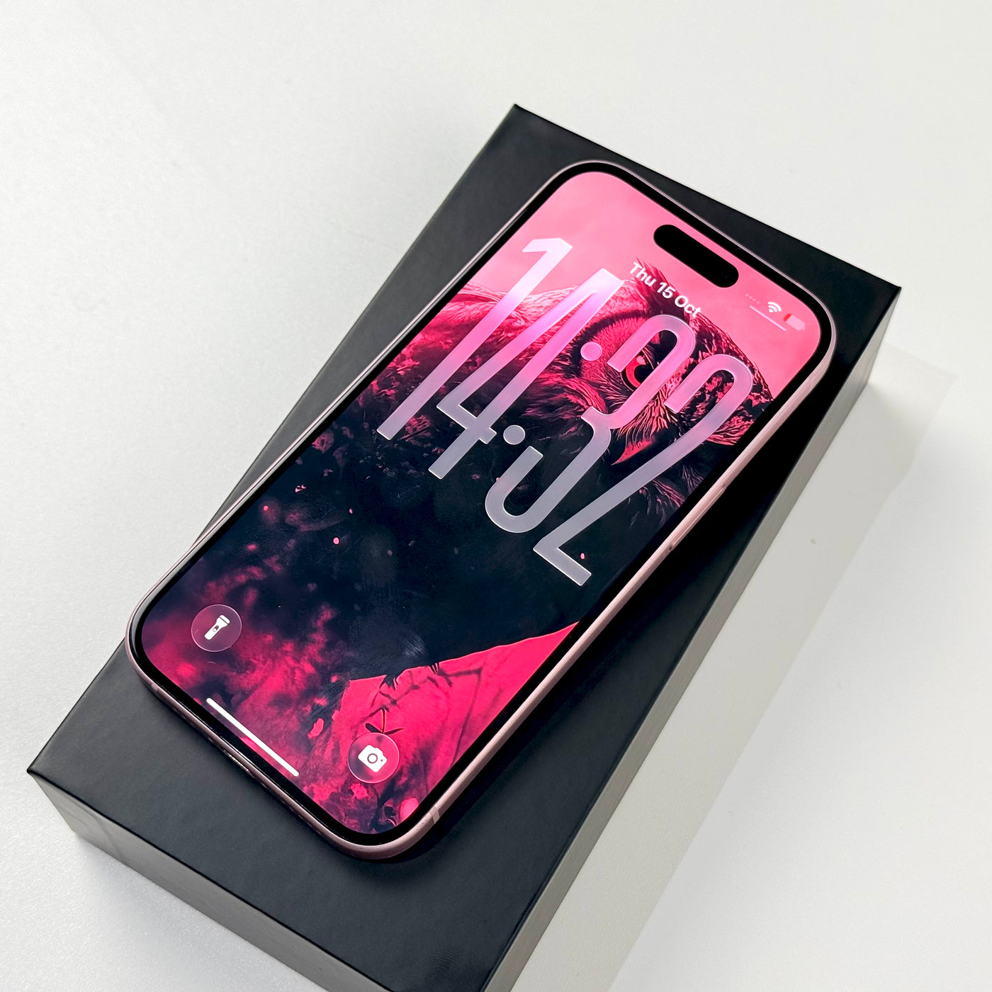 Pink iPhone 15 front screen in box, pre-owned Select condition