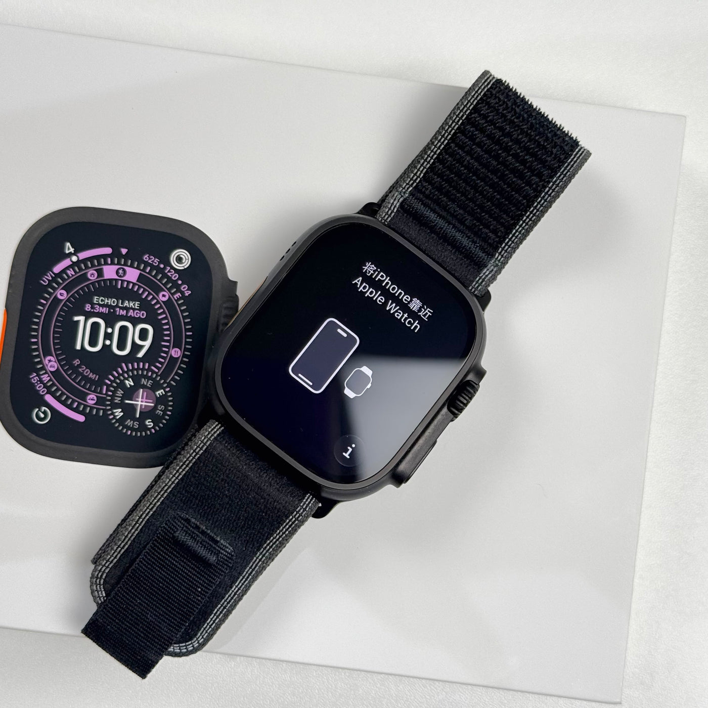Pre-owned Apple Watch Ultra 3 Black Titanium top view with Trail Loop, on original box - MacShack
