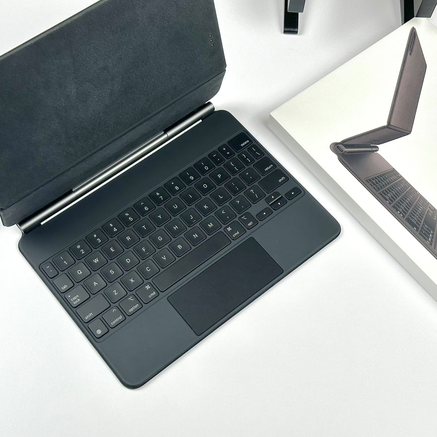 Top-down view of the keys and trackpad on the pre-owned black Apple Magic Keyboard for iPad Pro 11-inch and iPad Air