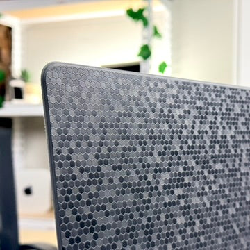 Close-up of the textured, speckled grey skin on a pre-owned Apple Magic Keyboard 12.9-inch