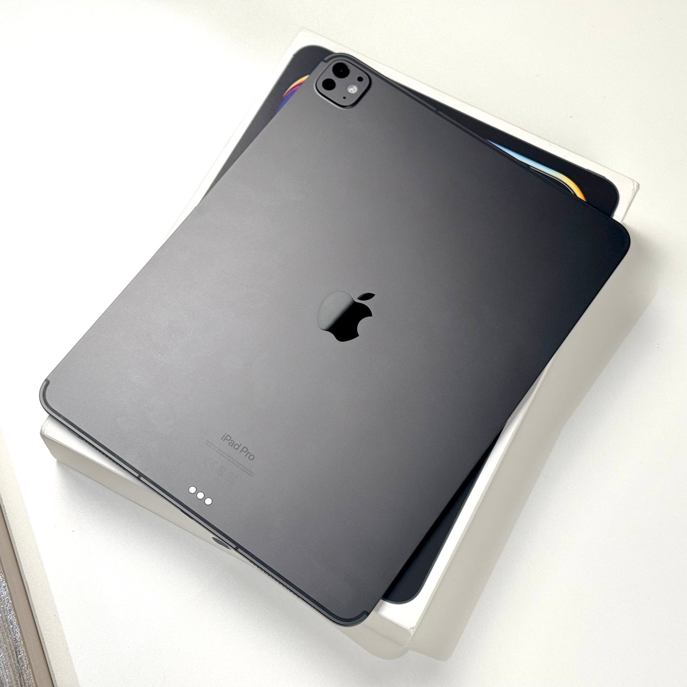 Back of a pre-owned iPad Pro 13-inch M4 in Space Black, angled view - Mac Shack