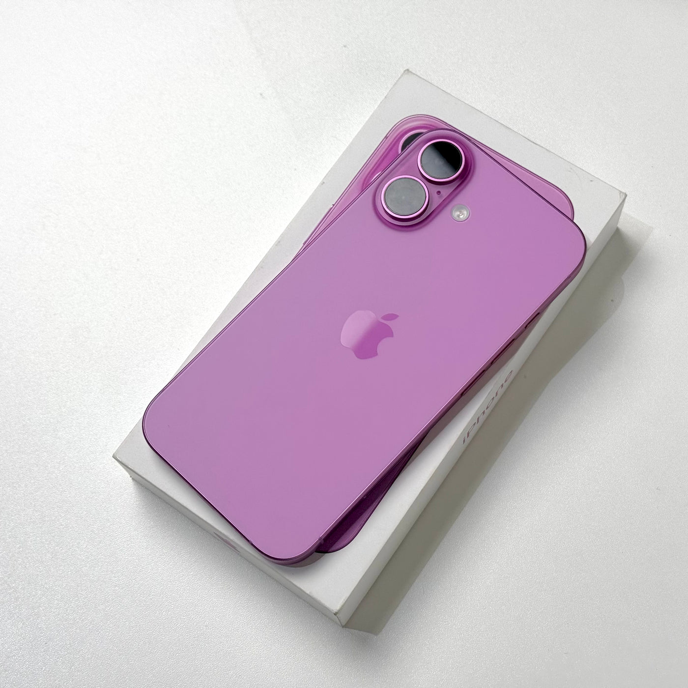 Back of a pre-owned iPhone 16 in Pink showing the dual camera - Mac Shack