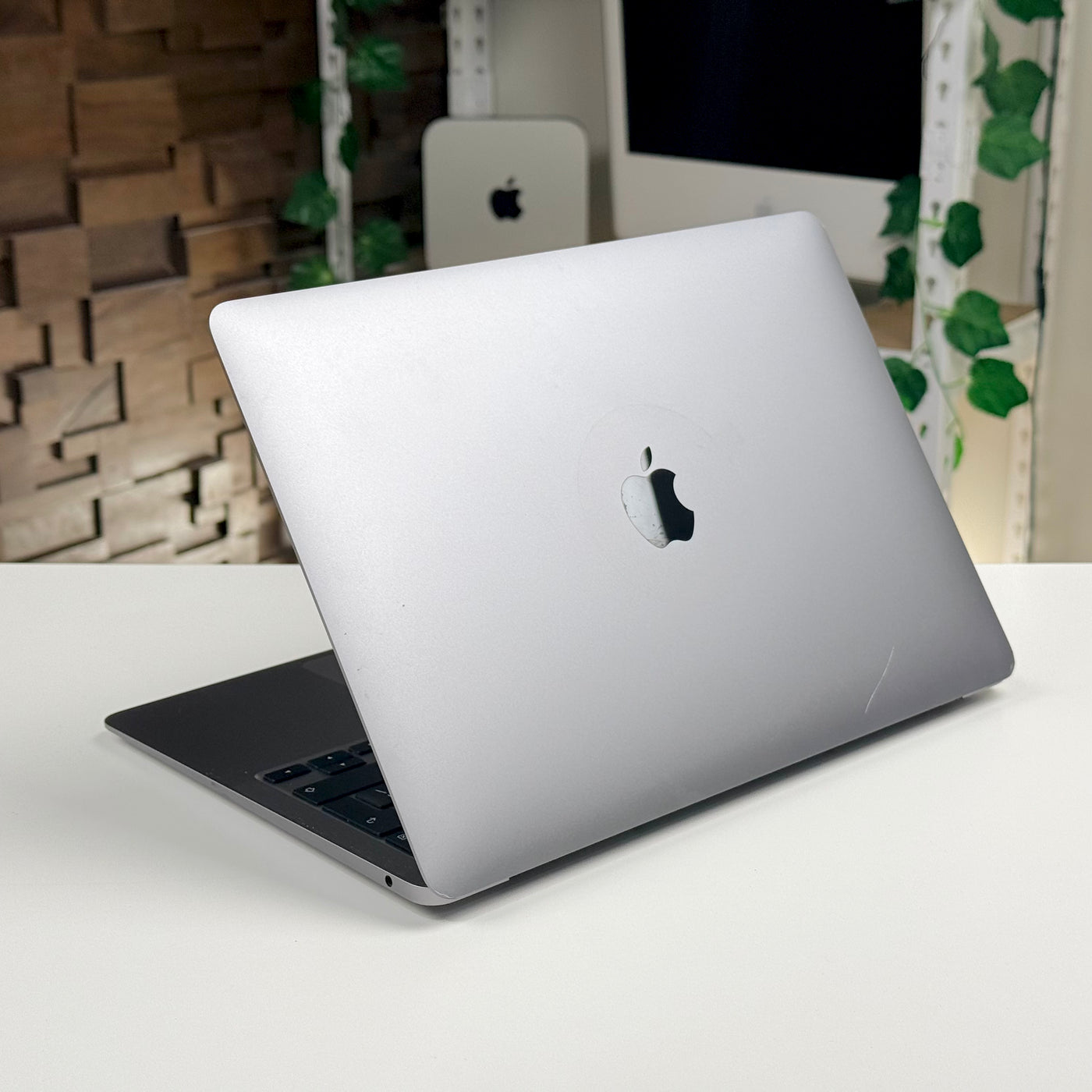 Rear view of the open pre-owned MacBook Air M1, showing the lid and Apple logo - Mac Shack