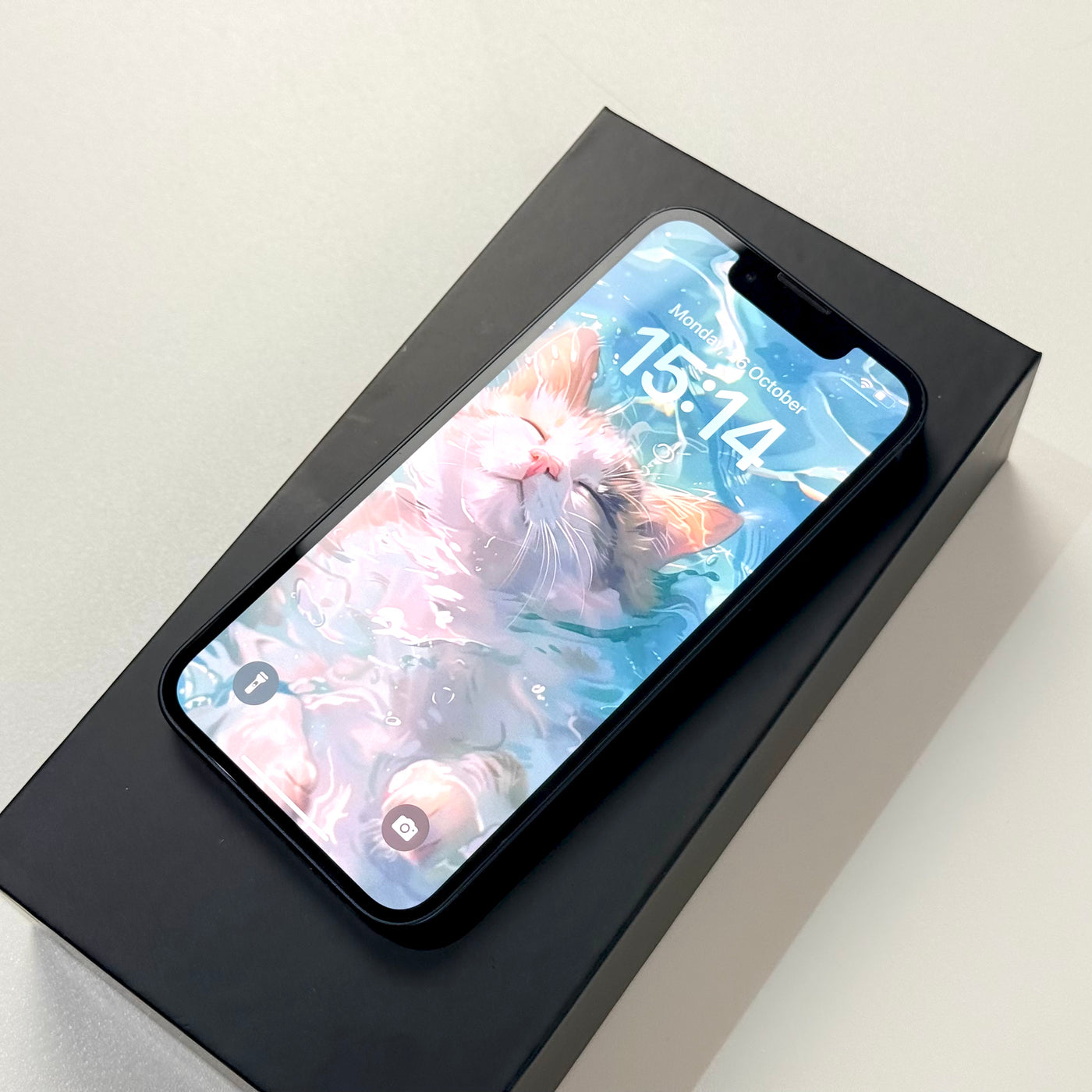 Pre-owned iPhone 13 mini 128GB Midnight in box with screen on, Select condition - Mac Shack
