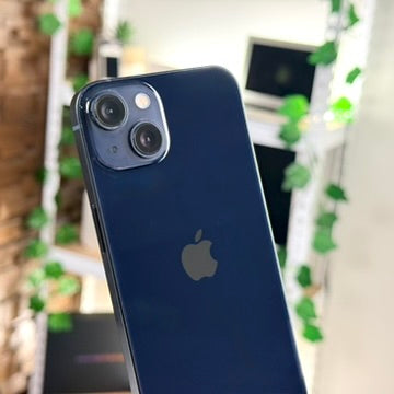 Back of pre-owned iPhone 13 Midnight showing dual 12MP camera and Apple logo - Mac Shack