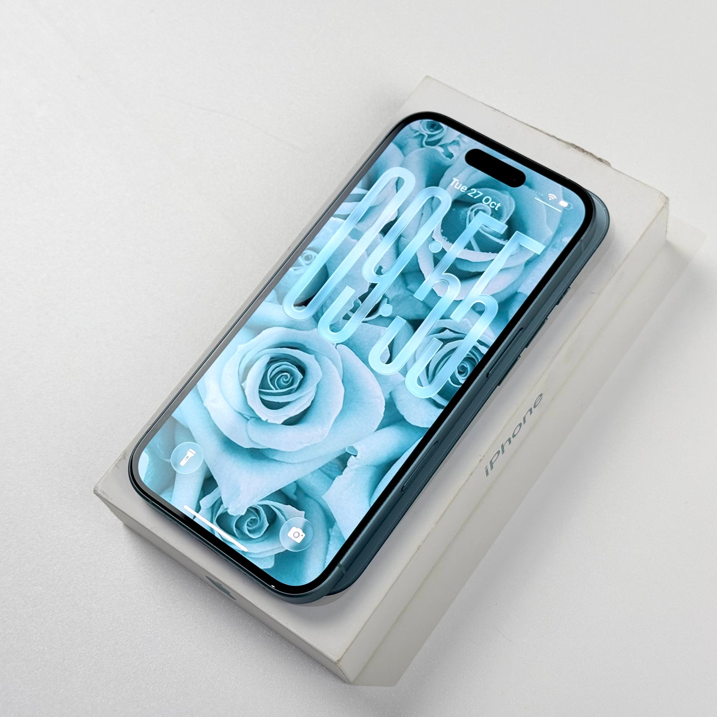 Pre-owned iPhone 16 Teal in Prime condition, screen on, with original box - MacShack