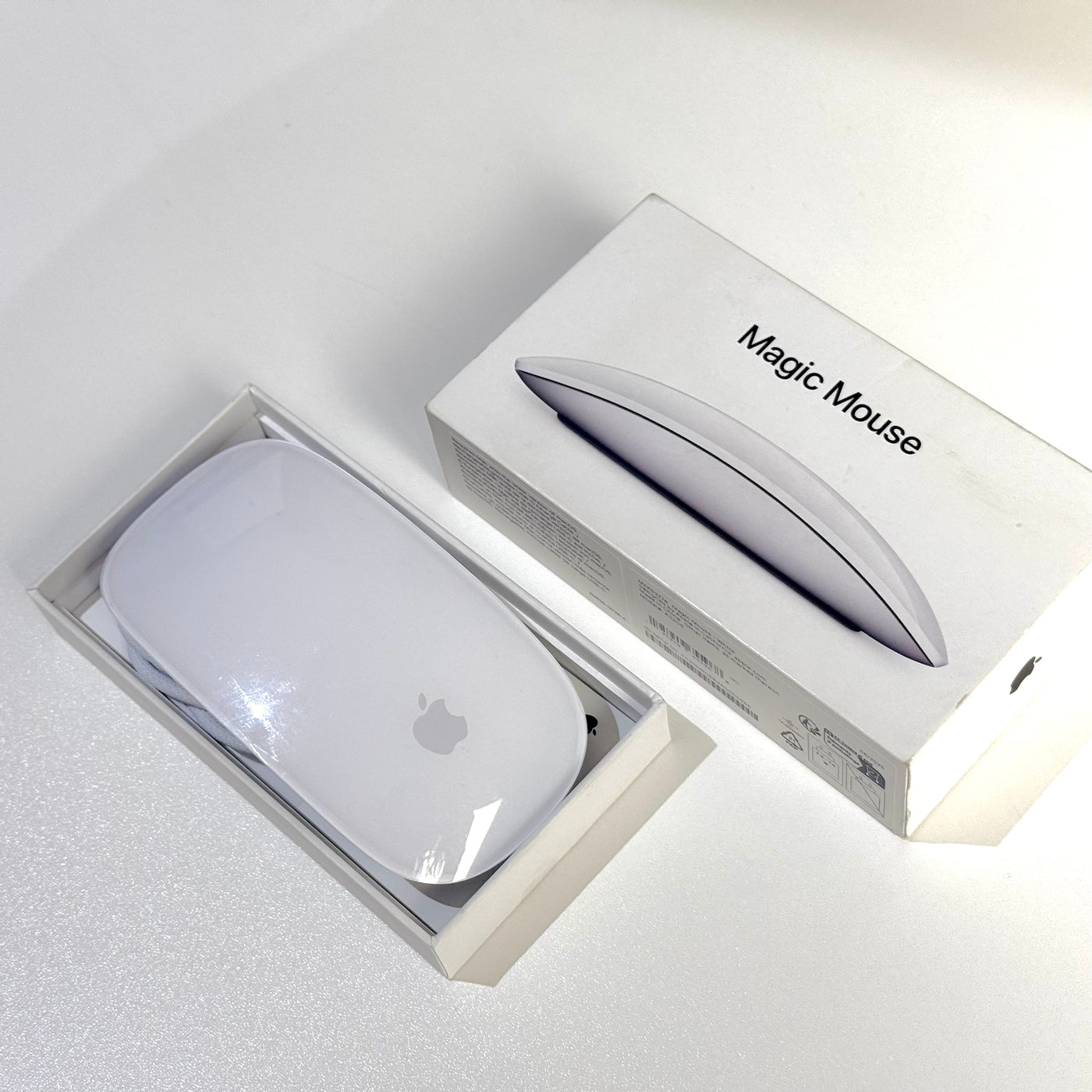 Pre-owned Apple Magic Mouse (USB-C) White next to its box - Mac Shack