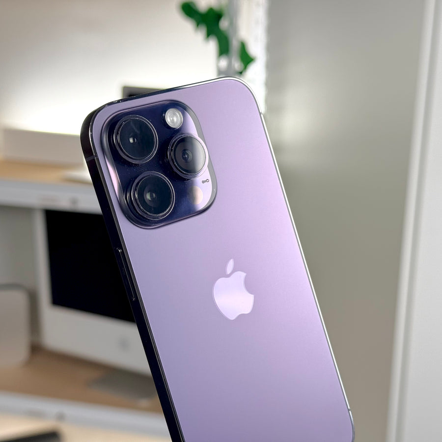 Pre-owned iPhone 14 Pro Deep Purple, back angle view showing cameras and Apple logo - Mac Shack