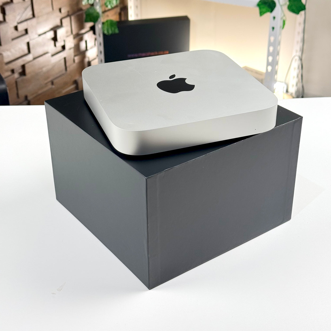 Pre-owned Mac mini M2 Pro in Silver sitting on its original box - Mac Shack