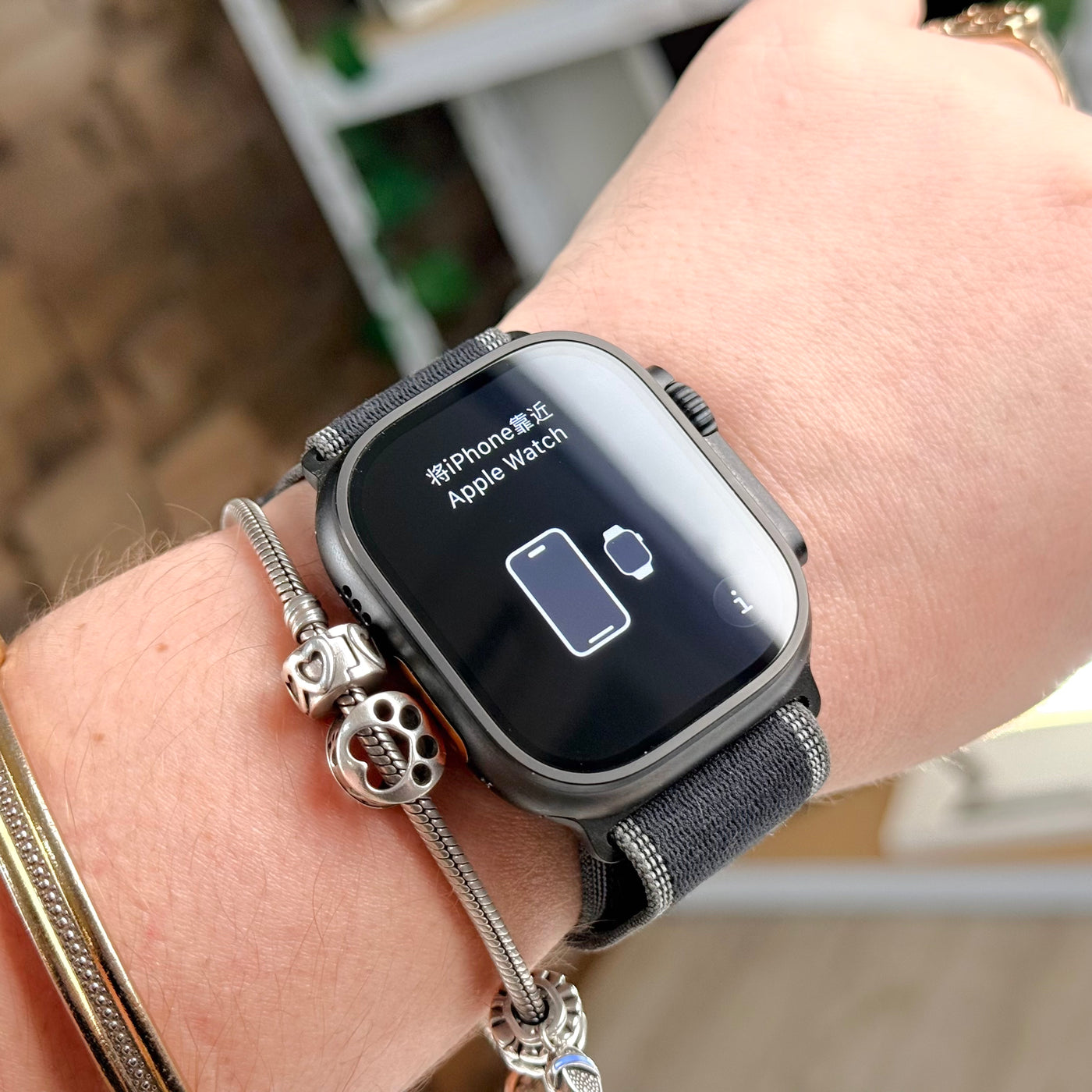Pre-owned Apple Watch Ultra 3 Black Titanium on wrist with Black/Charcoal Trail Loop - MacShack
